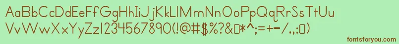 Primerprint Regular-Schriftart – Braune Schriften auf grünem Hintergrund