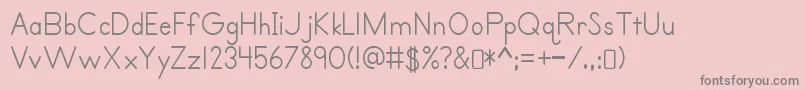 フォントPrimerprint Regular – ピンクの背景に灰色の文字