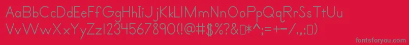 Fonte Primerprint Regular – fontes cinzas em um fundo vermelho