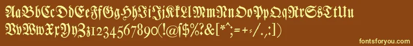 Chursaechsischefrakturunz1-fontti – keltaiset fontit ruskealla taustalla
