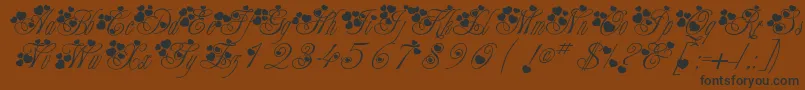 Fancyheartscript-Schriftart – Schwarze Schriften auf braunem Hintergrund