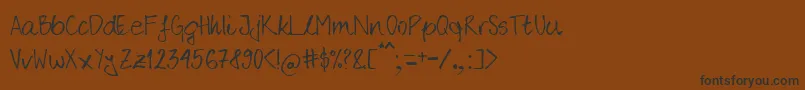 フォントRober – 黒い文字が茶色の背景にあります