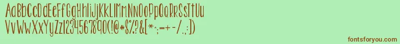 Шрифт Kgtwoisbetterthanone – коричневые шрифты на зелёном фоне