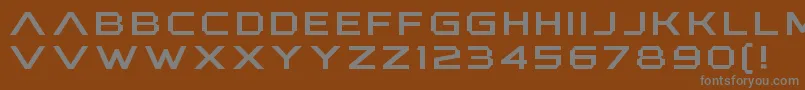 AnotherXanadu-fontti – harmaat kirjasimet ruskealla taustalla