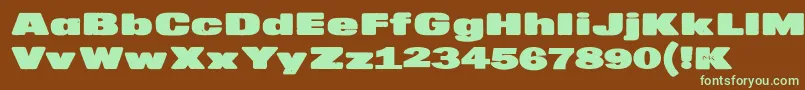 MkaputtExpanded-fontti – vihreät fontit ruskealla taustalla