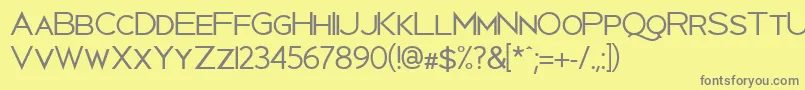 Uberlin-fontti – harmaat kirjasimet keltaisella taustalla