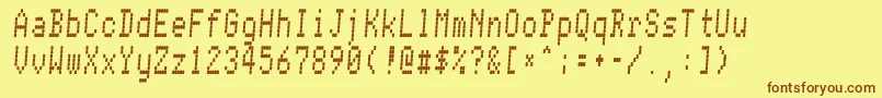 フォントConman – 茶色の文字が黄色の背景にあります。