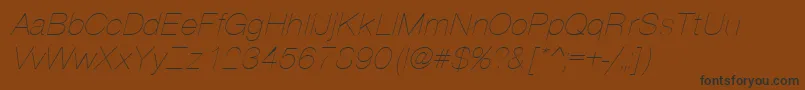 Fonte PartridgeThinOblique – fontes pretas em um fundo marrom
