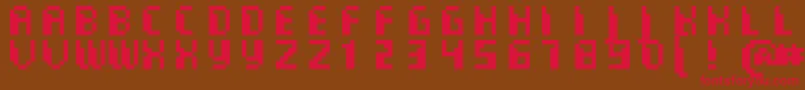 フォントCommoMonospaced – 赤い文字が茶色の背景にあります。