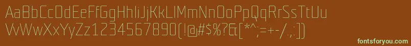 フォントTeutonweiss – 緑色の文字が茶色の背景にあります。