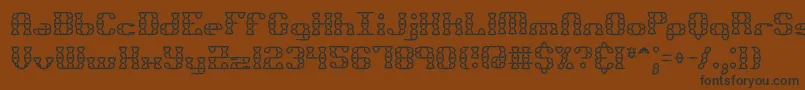 Bknuckst-fontti – mustat fontit ruskealla taustalla