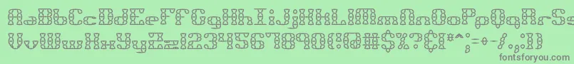 フォントBknuckst – 緑の背景に灰色の文字