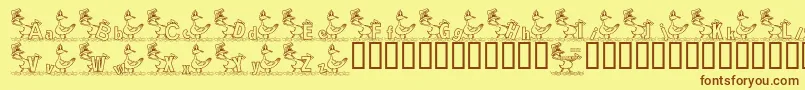 フォントKgDucks2 – 茶色の文字が黄色の背景にあります。