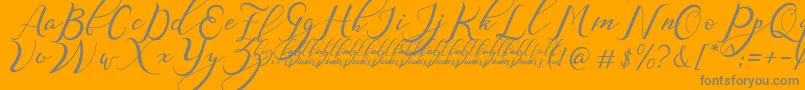 NazeefaDemo-Schriftart – Graue Schriften auf orangefarbenem Hintergrund