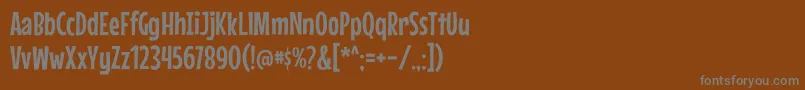 MousememoirsRegular-fontti – harmaat kirjasimet ruskealla taustalla