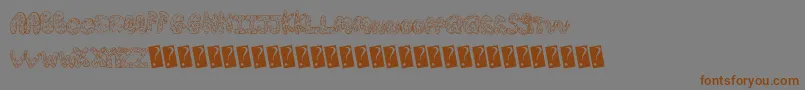 フォントCreamcone – 茶色の文字が灰色の背景にあります。