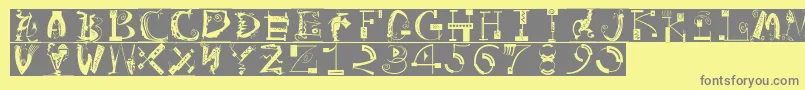 フォントArtistiquesBricks – 黄色の背景に灰色の文字