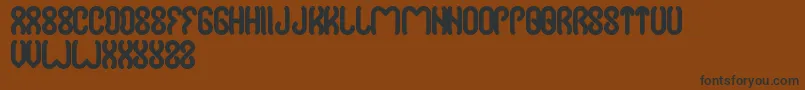 Więcej informacji o czcionce Jussta Czcionka Jussta – czarne czcionki na brązowym tle