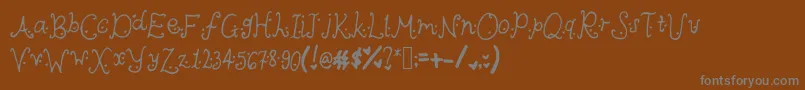 Cutieheartz-Schriftart – Graue Schriften auf braunem Hintergrund
