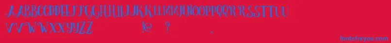 CurelyFreeTypeface-Schriftart – Blaue Schriften auf rotem Hintergrund