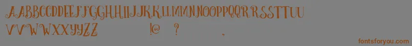 CurelyFreeTypeface-Schriftart – Braune Schriften auf grauem Hintergrund