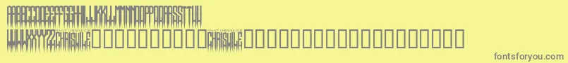 SpikedRegular-fontti – harmaat kirjasimet keltaisella taustalla