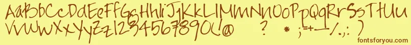 フォントJayne Print Hand – 茶色の文字が黄色の背景にあります。