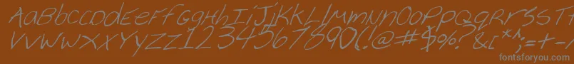 CheyenneHandItalic-fontti – harmaat kirjasimet ruskealla taustalla