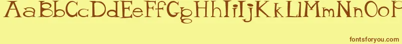 MisterTate Font – Brown Fonts on Yellow Background