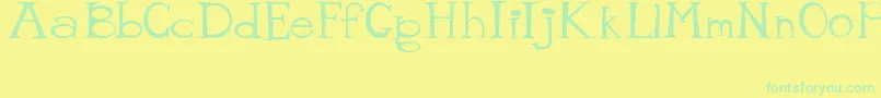 MisterTate Font – Green Fonts on Yellow Background