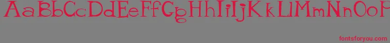 MisterTate Font – Red Fonts on Gray Background