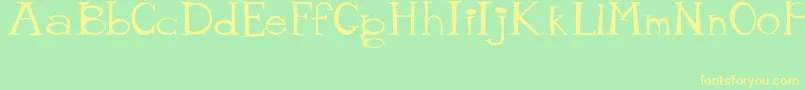 MisterTate Font – Yellow Fonts on Green Background