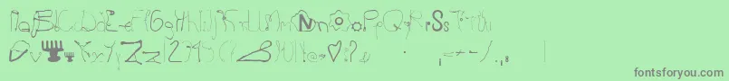 Kurzwaren-Schriftart – Graue Schriften auf grünem Hintergrund