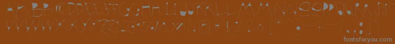 Krakelfabet Font – Gray Fonts on Brown Background