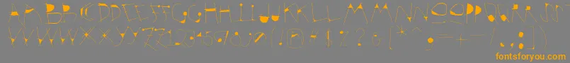 フォントKrakelfabet – オレンジの文字は灰色の背景にあります。