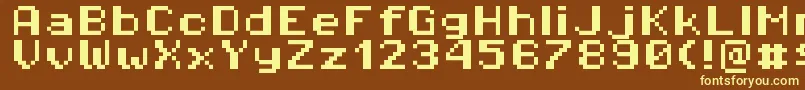 Pixeloperatorhb8-fontti – keltaiset fontit ruskealla taustalla