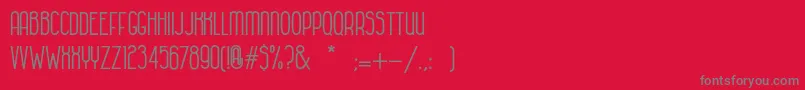HabanacolonialBold-Schriftart – Graue Schriften auf rotem Hintergrund