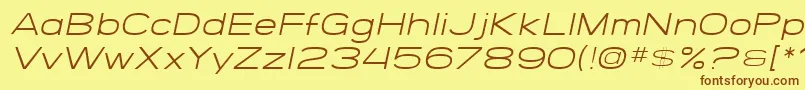 SfGrandezzaLightOblique-Schriftart – Braune Schriften auf gelbem Hintergrund
