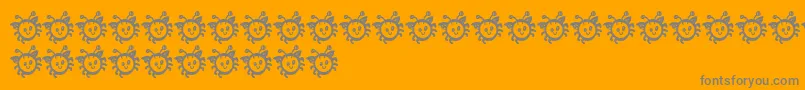 Fonte CuddleBug – fontes cinzas em um fundo laranja