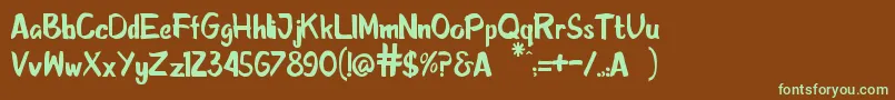 フォントSketcha – 緑色の文字が茶色の背景にあります。