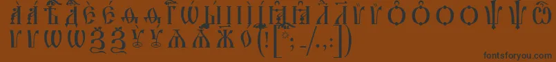 フォントIrmologionCapsIeucsSpacedout – 黒い文字が茶色の背景にあります