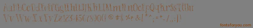 BadKing Font – Brown Fonts on Gray Background