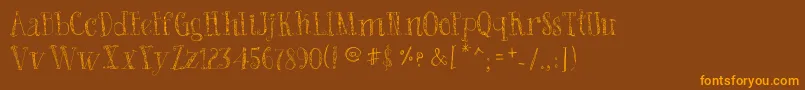 フォントBadKing – オレンジ色の文字が茶色の背景にあります。