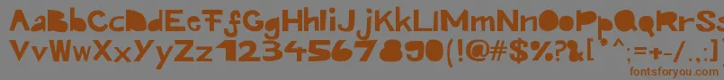 フォントKroeskop – 茶色の文字が灰色の背景にあります。