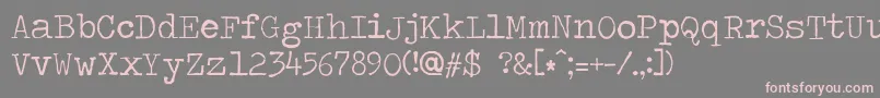 フォントTravelingtypewriter – 灰色の背景にピンクのフォント