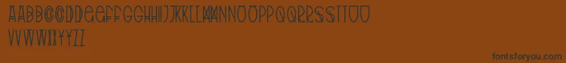 TribalType-Schriftart – Schwarze Schriften auf braunem Hintergrund