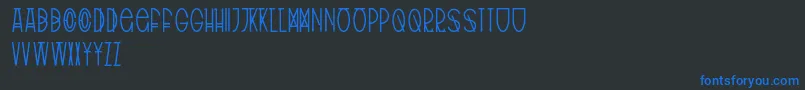 フォントTribalType – 黒い背景に青い文字