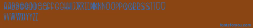 TribalType-fontti – siniset fontit ruskealla taustalla