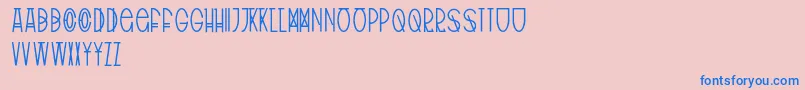 フォントTribalType – ピンクの背景に青い文字