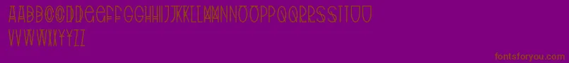 フォントTribalType – 紫色の背景に茶色のフォント